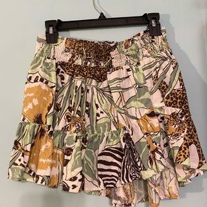 Jungle themed ruffle skirt. Lower length in back. Scrunch midsection